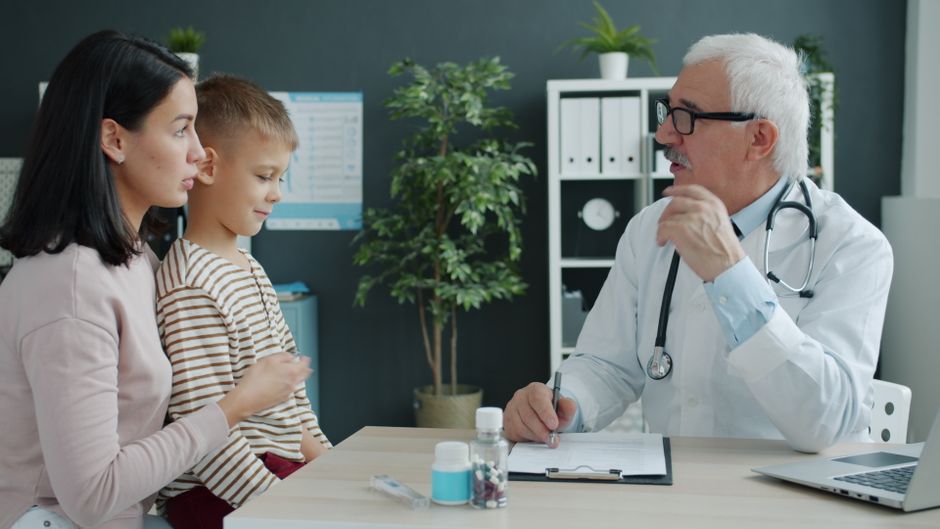 Family members consulting with advisor around conference table