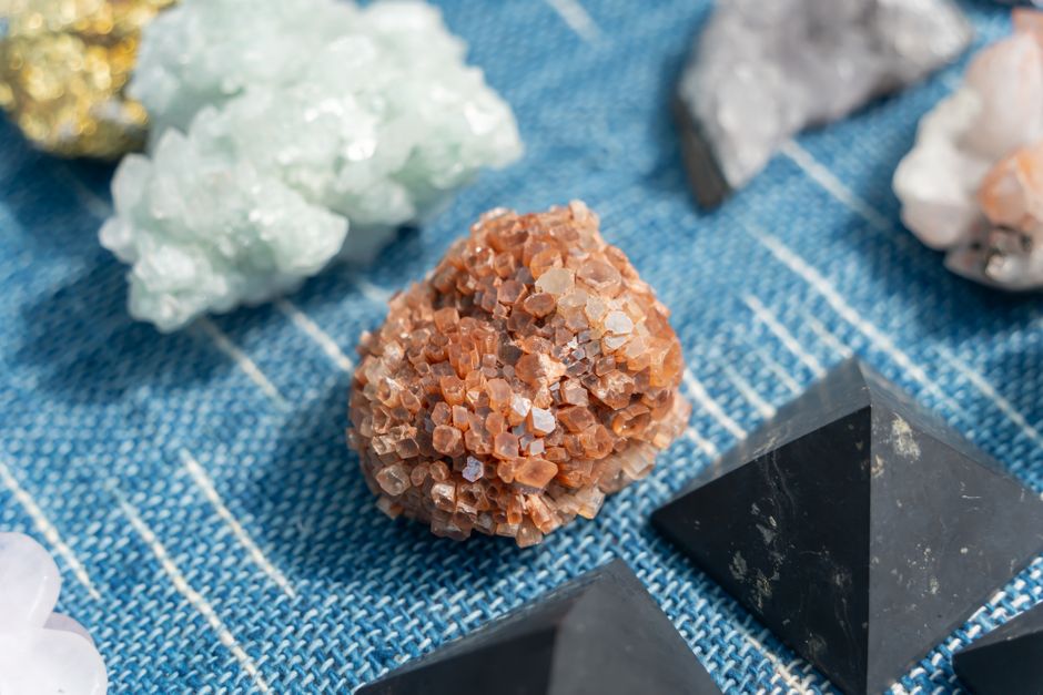 Variety of natural mineral stones displayed on shelves.