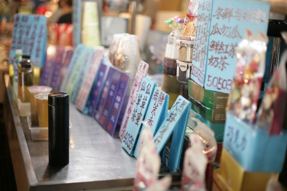 Selection of Taiwanese bubble tea drinks in clear cups on a counter