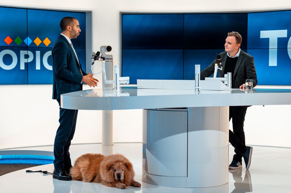 Studio set of a comedy television show with hosts