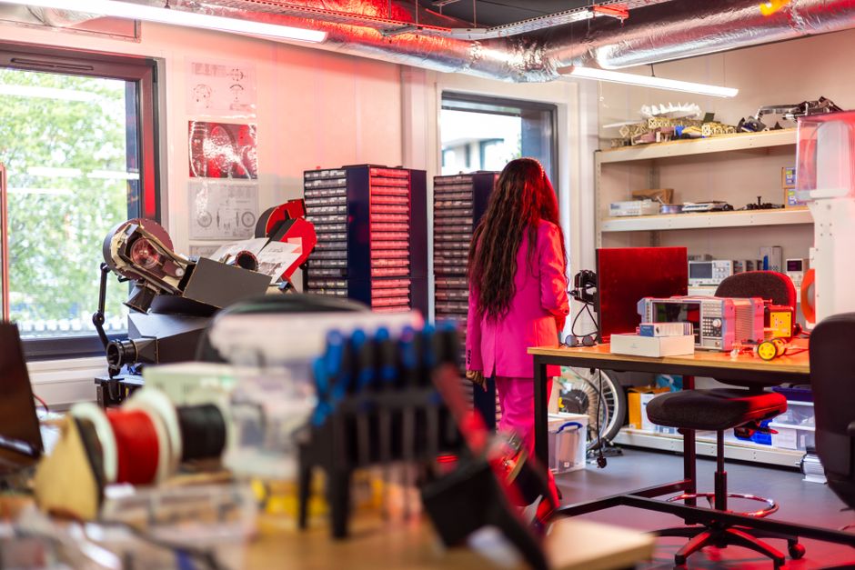 Photonics engineers at workbench in lab