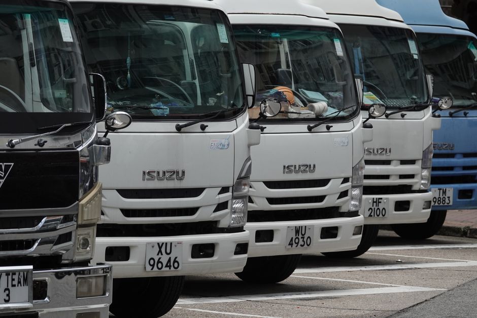 A line of commercial trucks demonstrating fleet insurance coverage