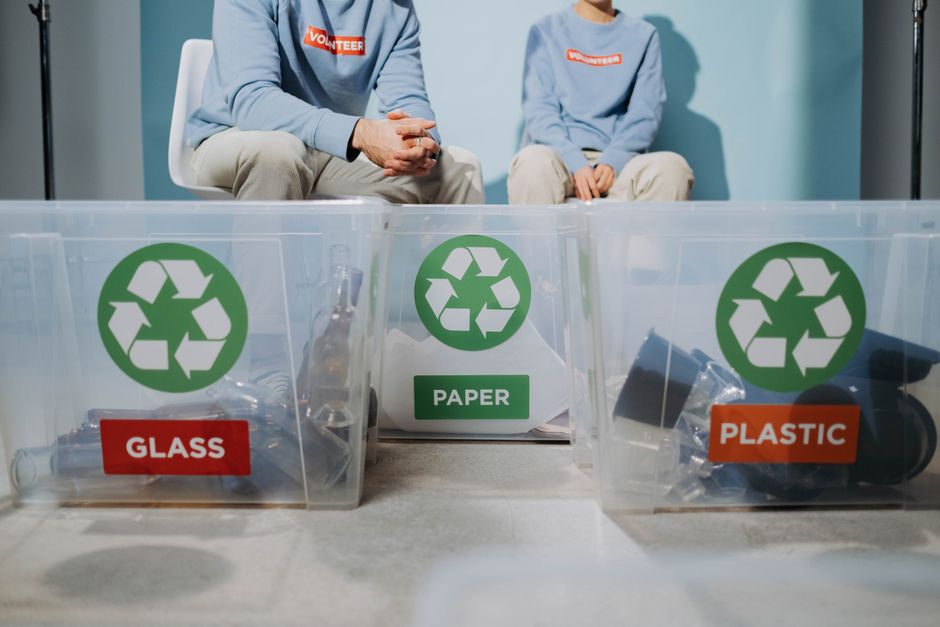 Community volunteers collecting bottles for recycling initiative