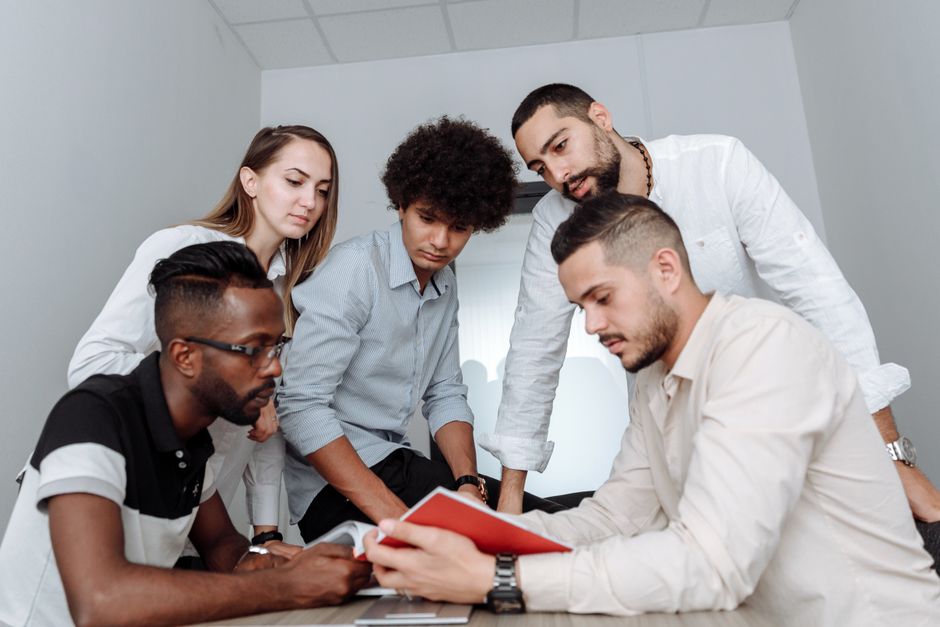 A diverse business team collaborating around a conference table