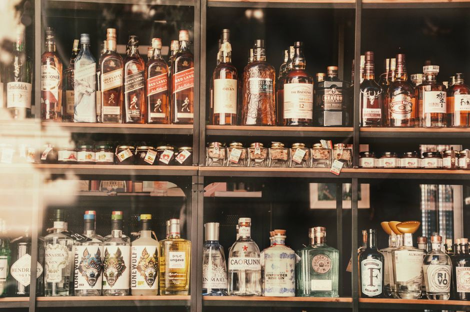 Liquor store shelves with various bottles