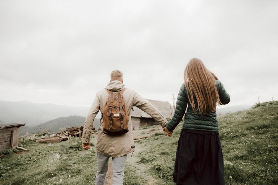 Couple on a romantic getaway at a mountain cabin