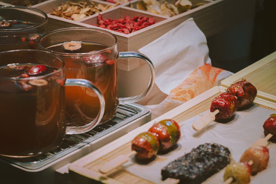 Dried jujube (unabi) and goji berries arranged on a wooden table