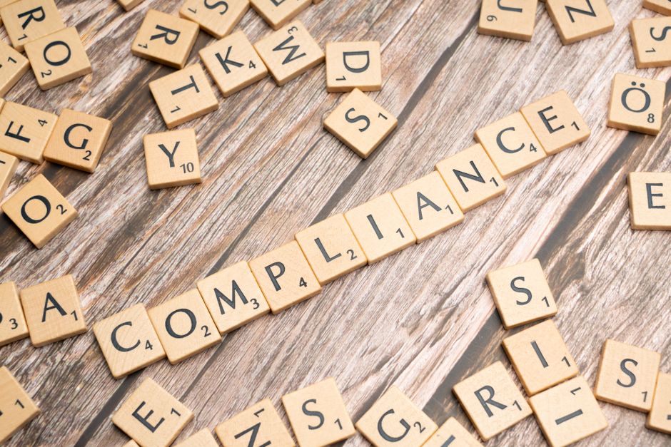 Consultants reviewing compliance and risk management strategies