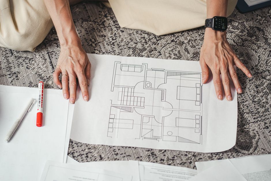 Architect reviewing blueprints for a residential project