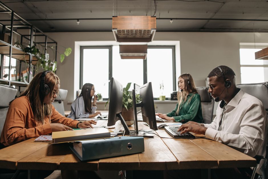 IT professionals providing managed services in a collaborative workspace