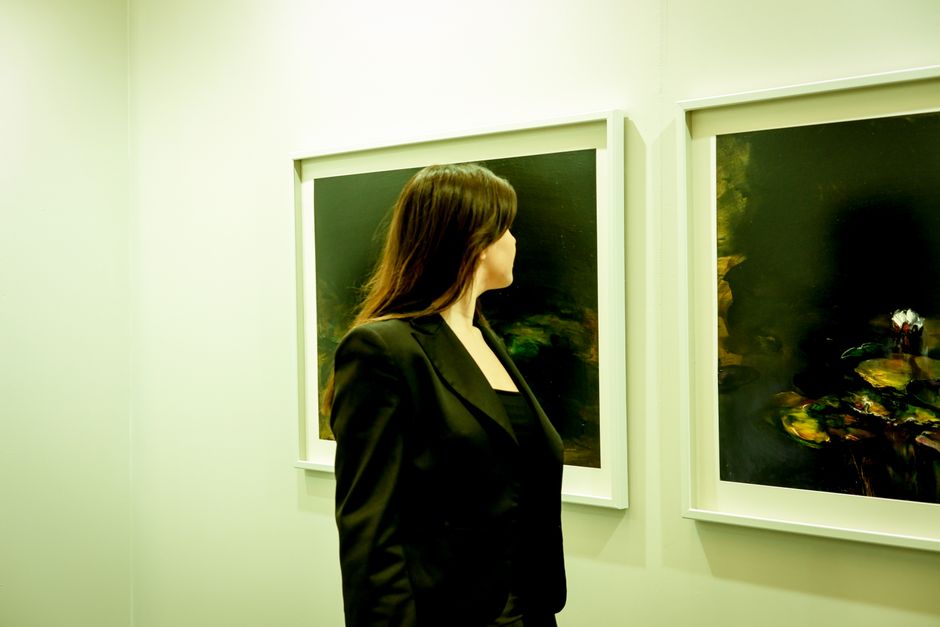 Gallery staff overseeing installation of contemporary artworks