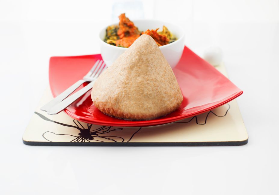 Fufu being served with egusi soup in a Ghanaian/Nigerian restaurant
