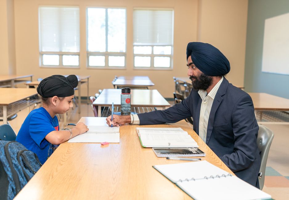 Mentor providing study planning advice to a motivated high school student
