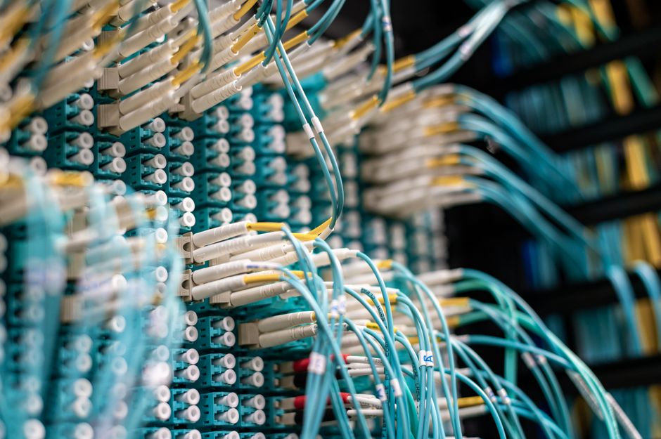 Network cables and server racks in a data center
