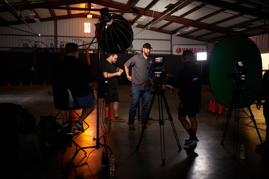 Crew filming a commercial video in a professional studio