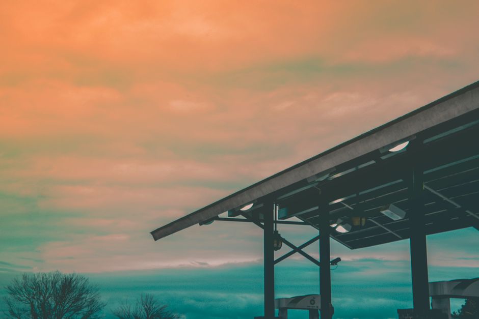 Exterior view of a modern gas station at sunset