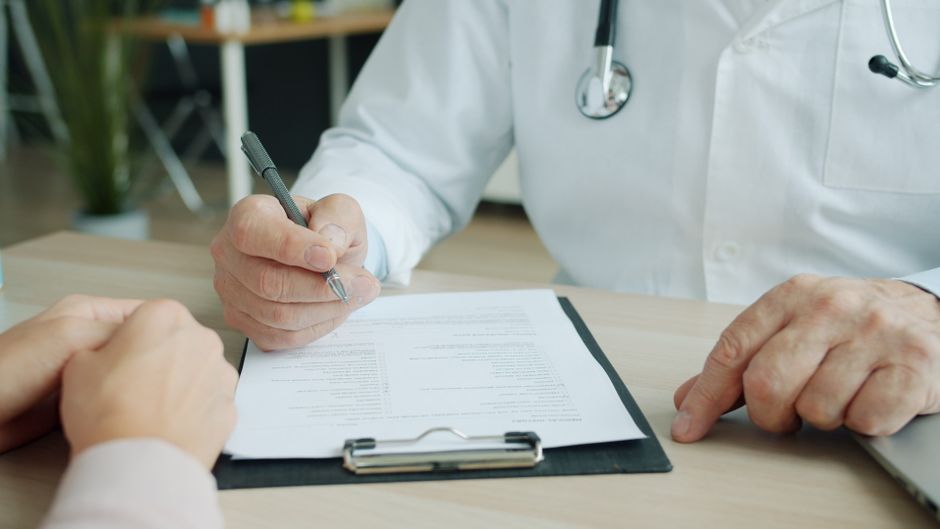 Medical insurance claim forms and a phone