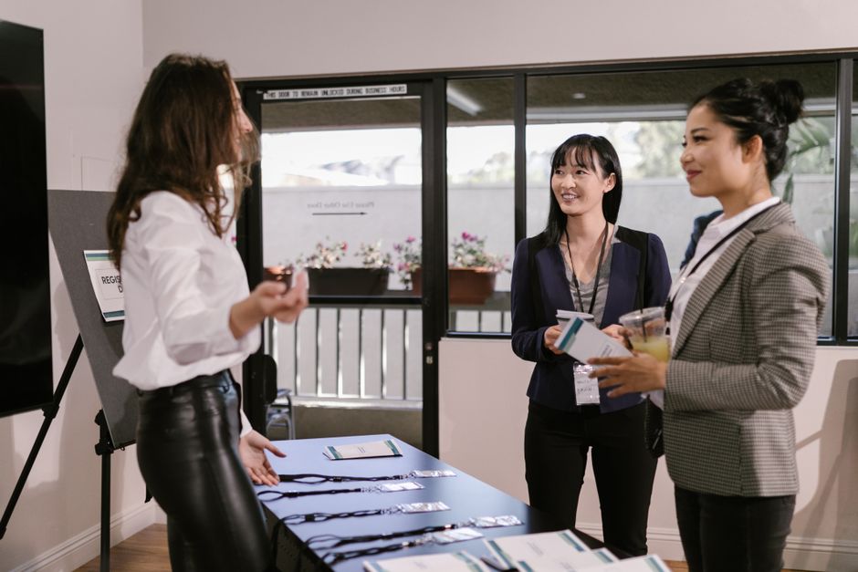 Professional women networking at a business event
