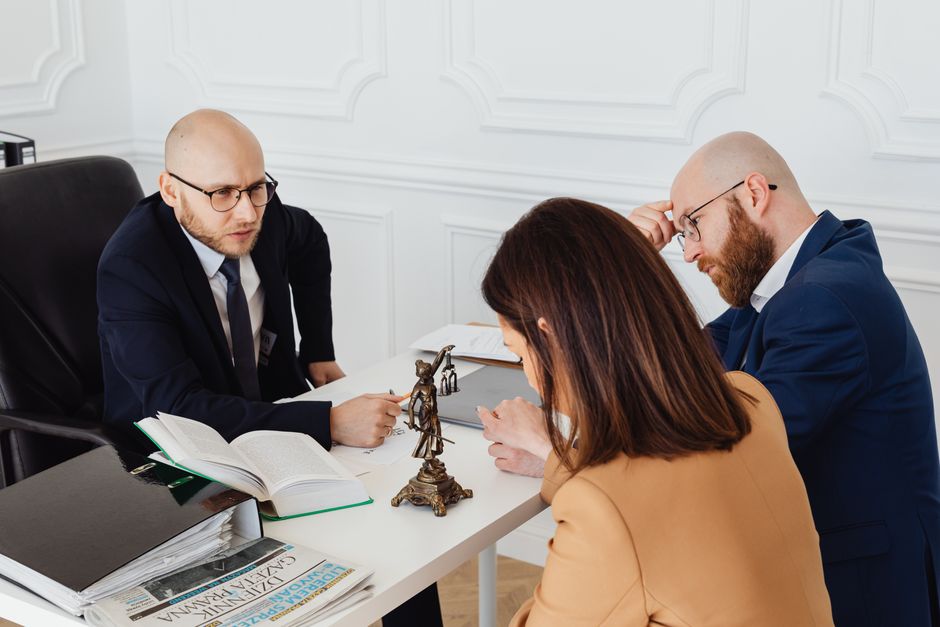 Clients meeting with an attorney in a professional law office