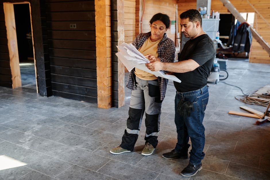 Flooring contractor consulting with a client about floor options