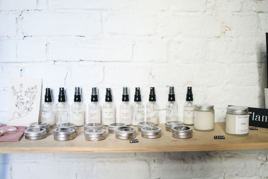 Organic cosmetic products on wooden shelf