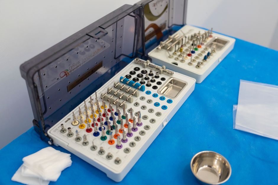 Close-up of dental implant components and tools on a table