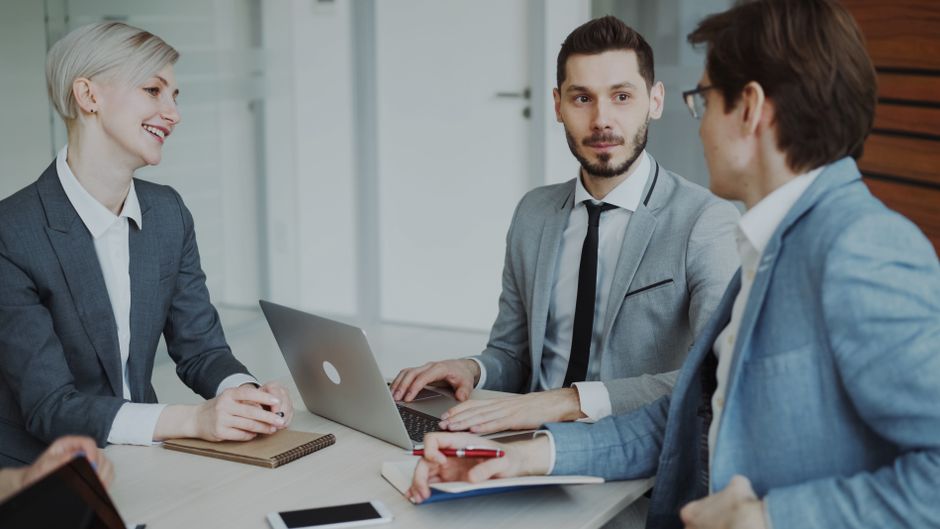 Asian female business owner guiding a discussion