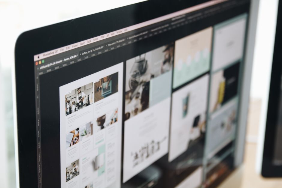 UI/UX team designing a modern website on digital tablets and monitors