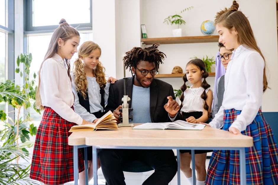 Students from diverse backgrounds taking part in a group educational program.