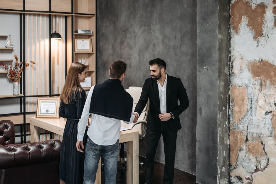 Consultant and clients engaged in a business meeting