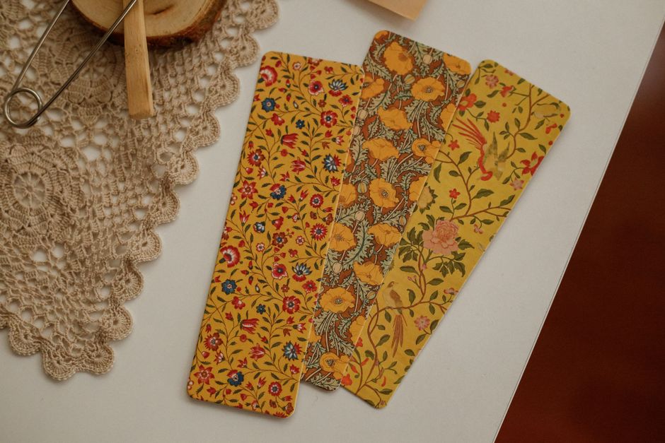 Handmade bookmarks and book accessories on a table.