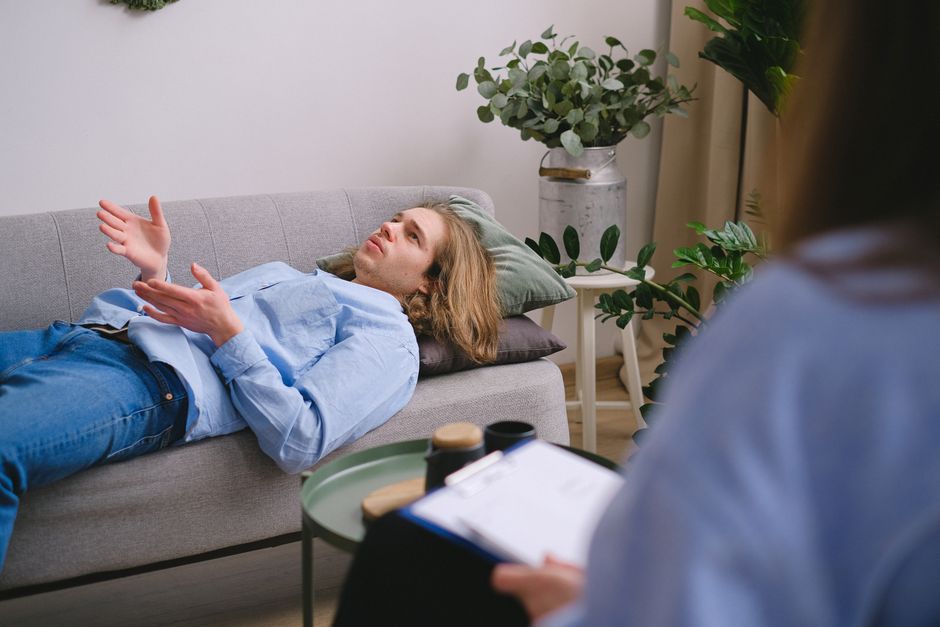 Therapist explaining cognitive behavioral therapy to a client