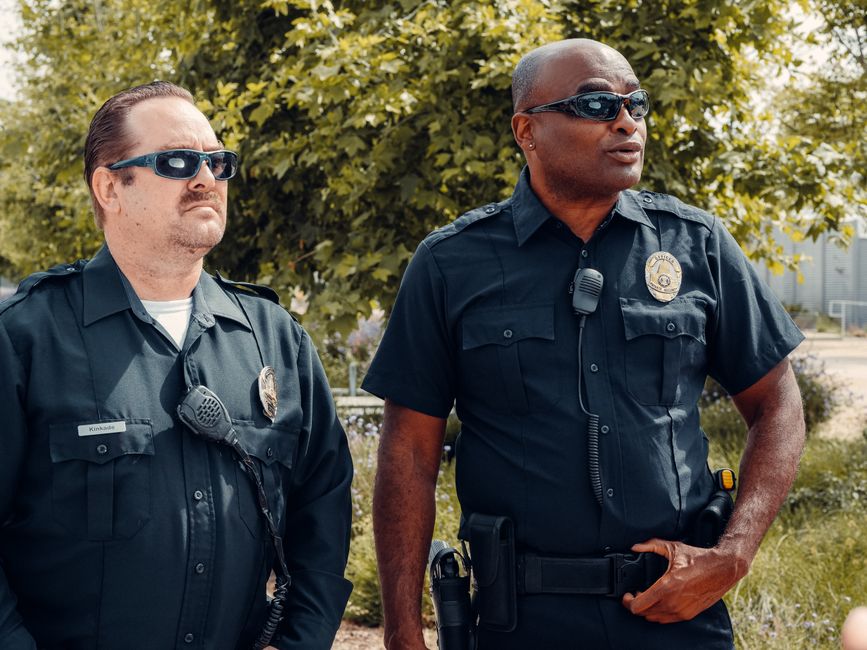 Municipal staff and police officers cooperating at a community outreach event