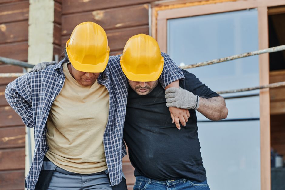 Construction worker scene emphasizing safety and injury prevention