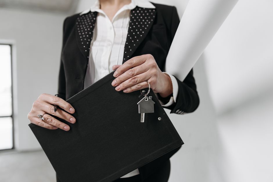 Real estate paperwork with apartment keys placed on top