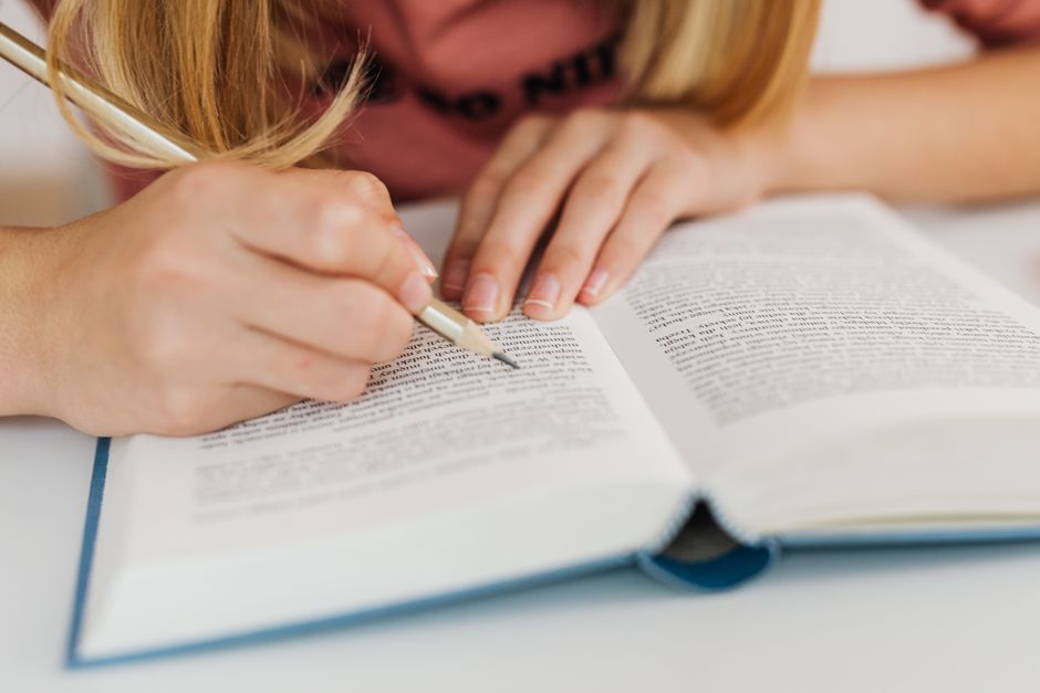 A consultant reviewing a college application essay with a student