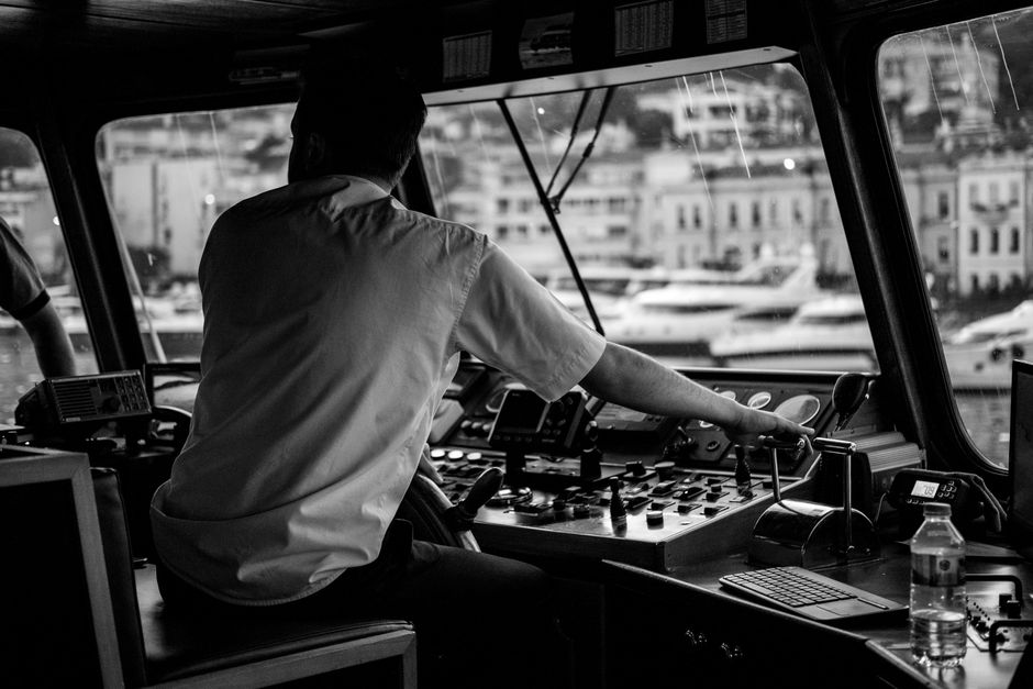 Charter captain steering a boat on the ocean