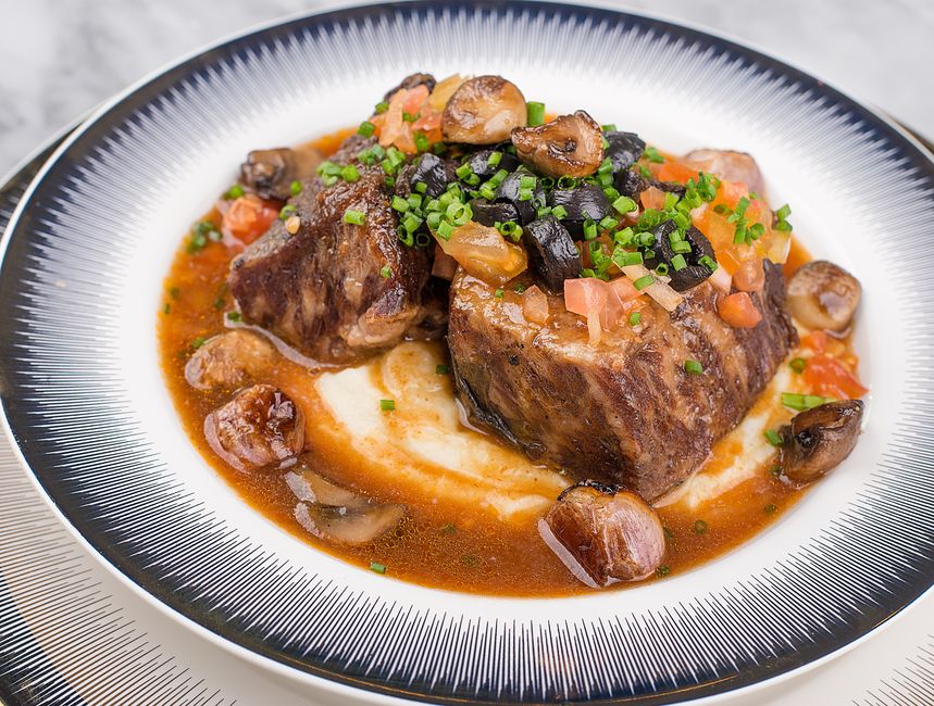 Hearty beef bourguignon in a warm bistro setting