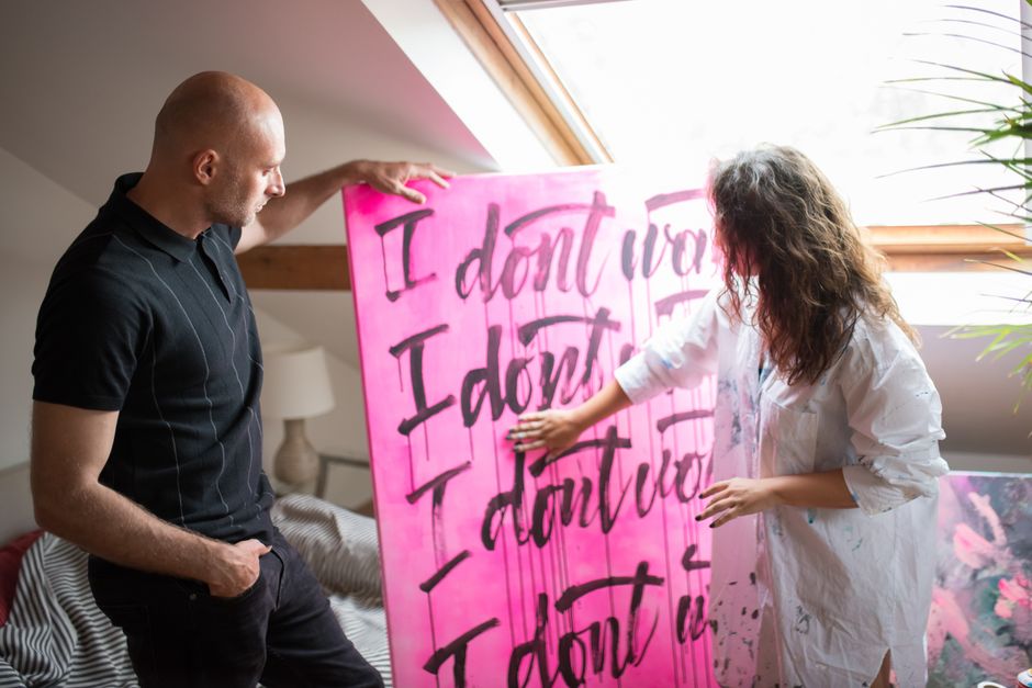 Group of artists working on a collaborative installation project