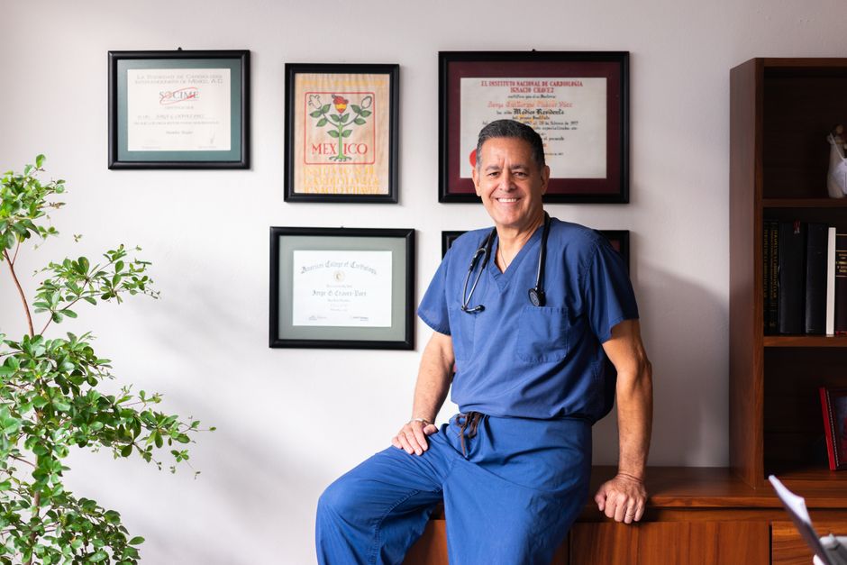 Doctor's office portrait with medical degree on the wall