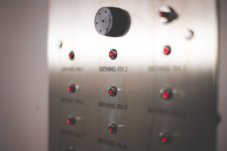 Intruder alarm system with control panel placed on an indoor wall.