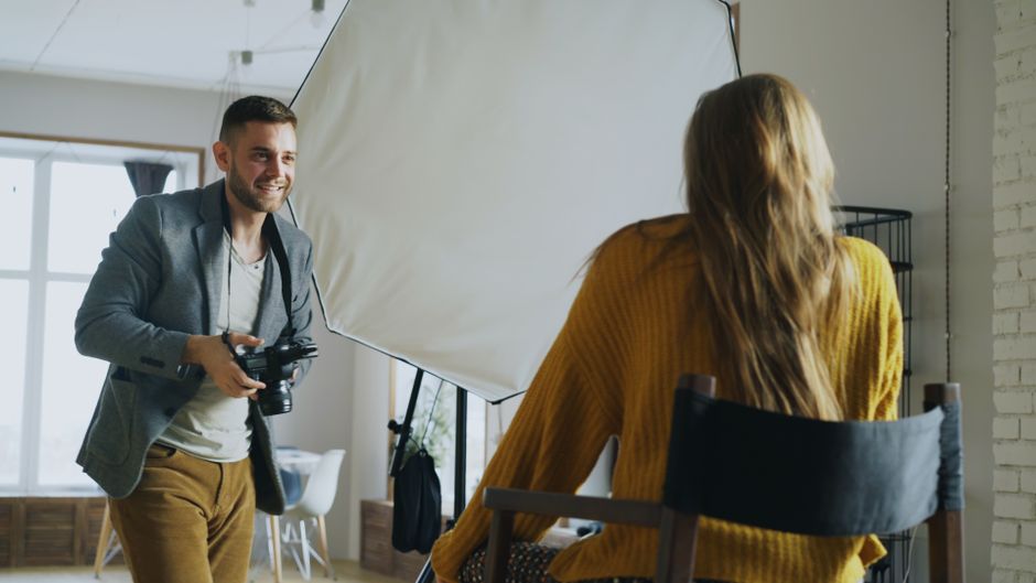 An indoor professional portrait photography session in progress