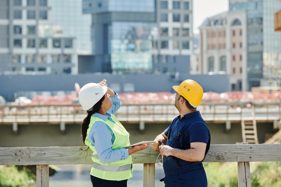 Architects and engineers at commercial construction site