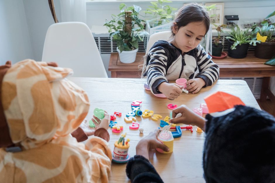 Diverse children playing with educational toys together
