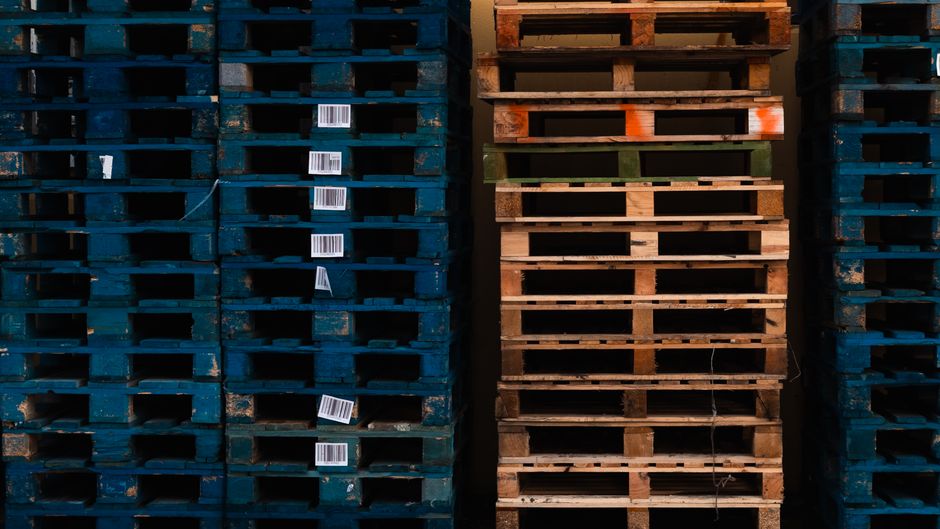 Commercial goods being loaded onto a freight truck at a distribution dock