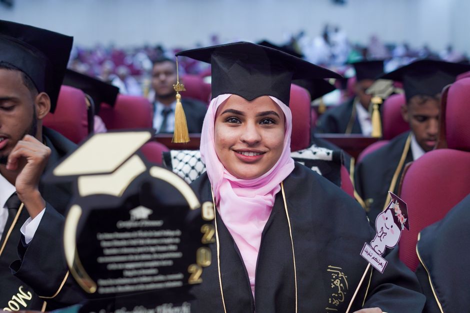 Graduation ceremony representing student loan debt collection