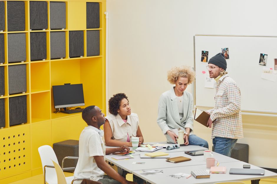 Business professionals collaborating in modern meeting space