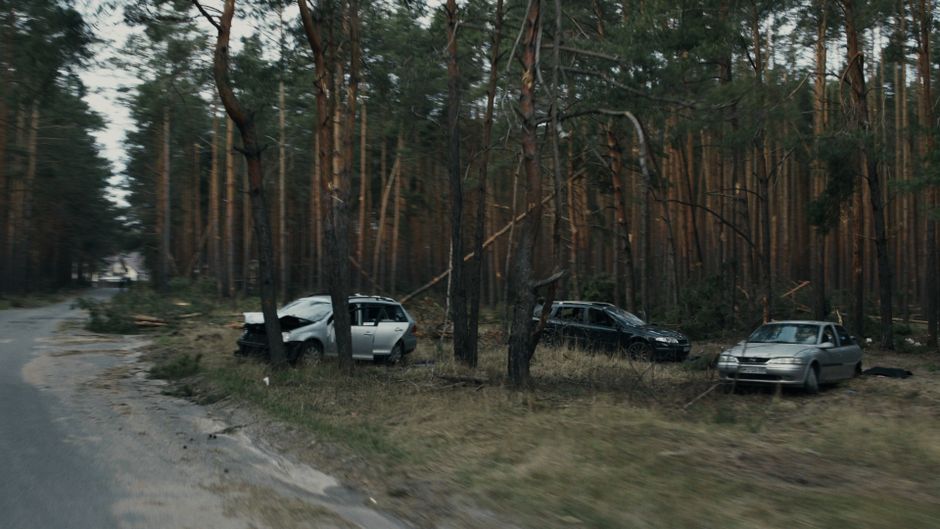 Scene of a car accident showing damaged vehicles on a street