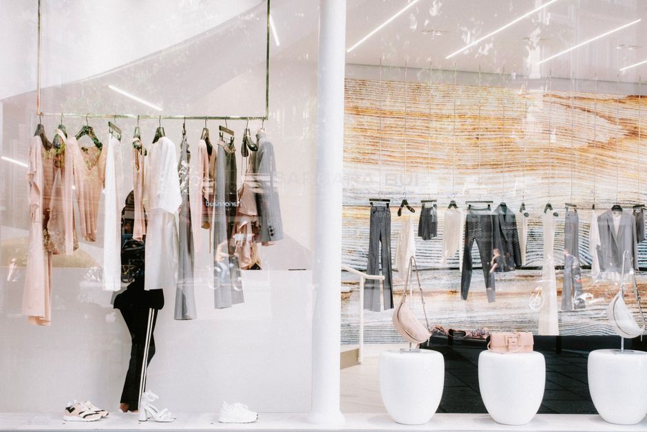 Modern designer clothing racks in a boutique fashion store