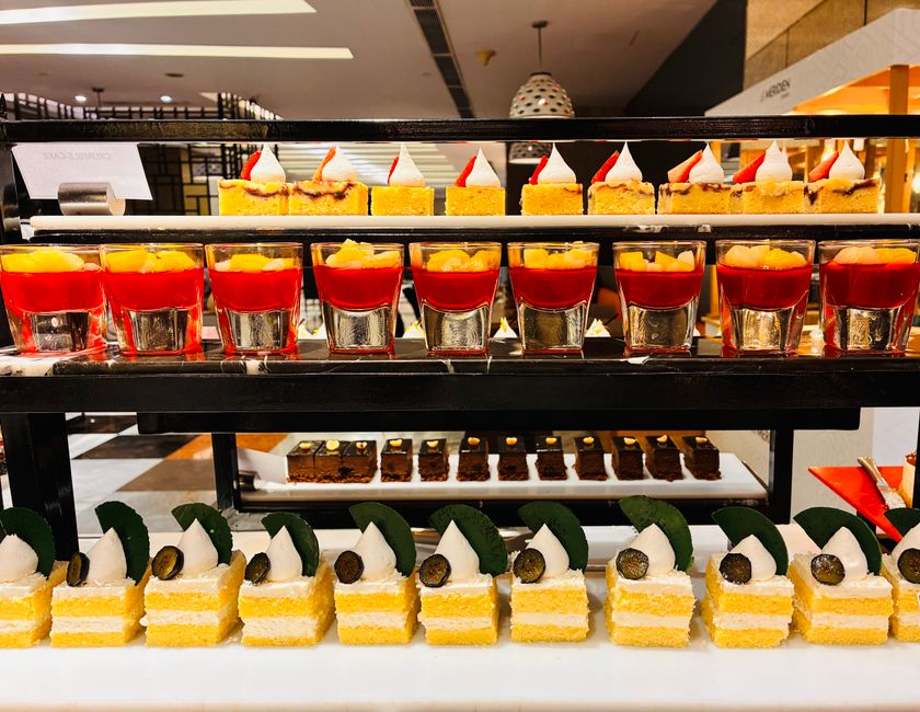Asian-style fruit desserts and jellies arranged on plates